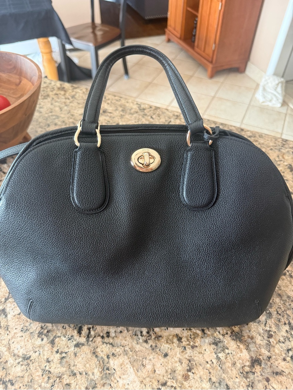 Coach Prince Street Mini Satchel crafted from textured black leather.